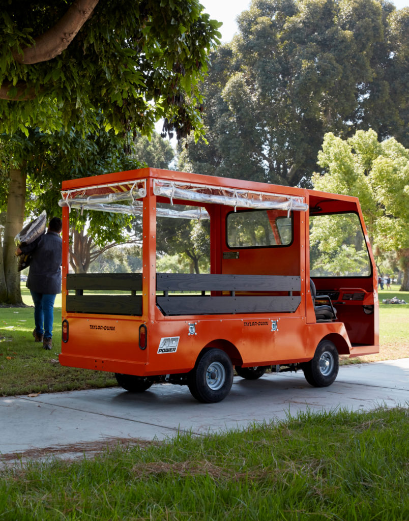 Orange vinyl sided utility vehicle