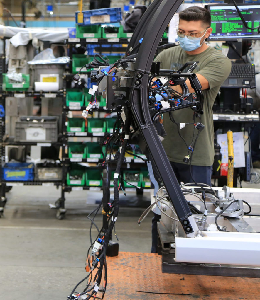 Man working with electronic cords