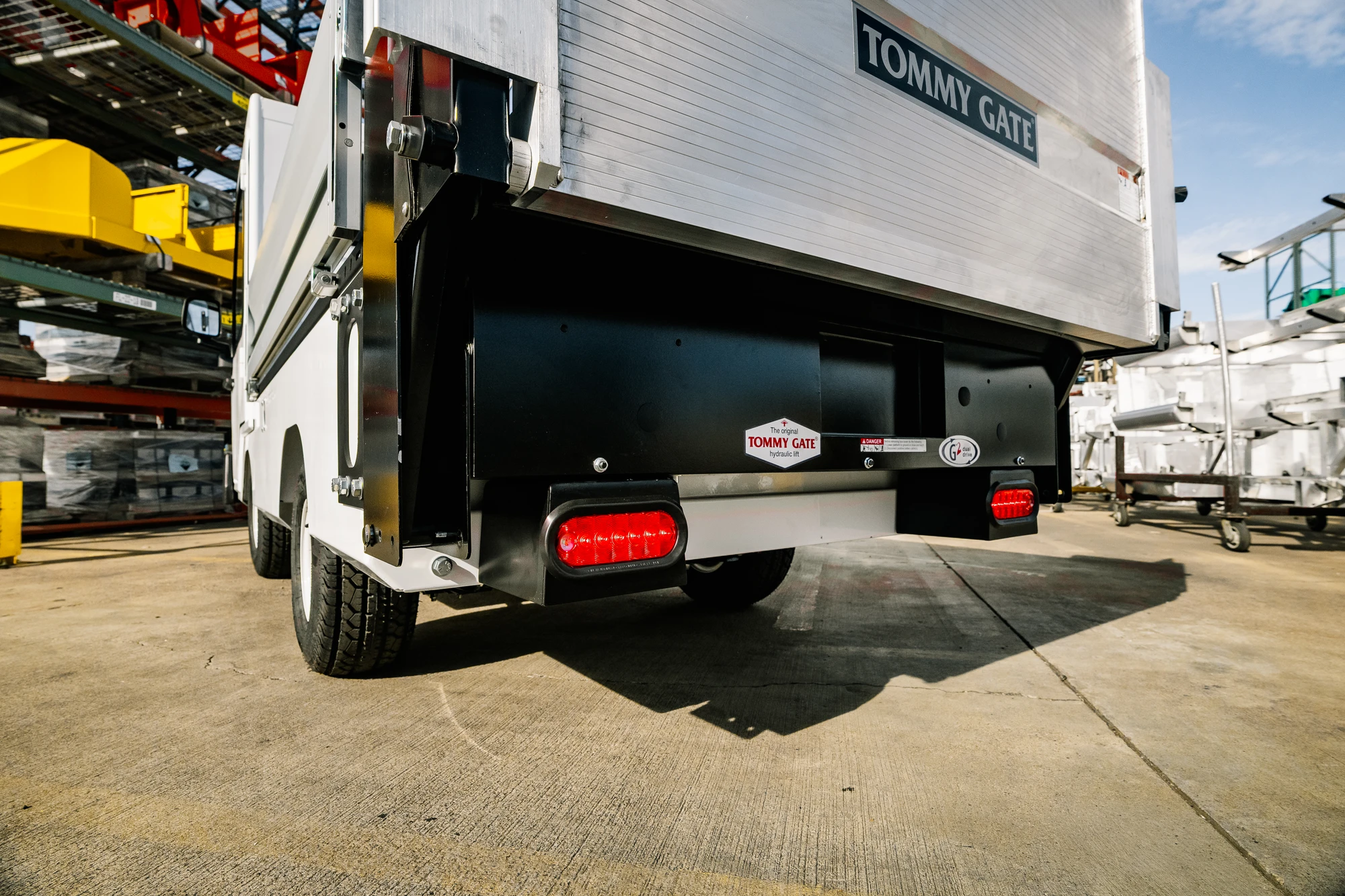 Taylor-Dunn-Bigfoot-XL-Liftgate-Tommy-Gate-Manufacturing-Rear-Brake-Lights-Detail-arm-opt